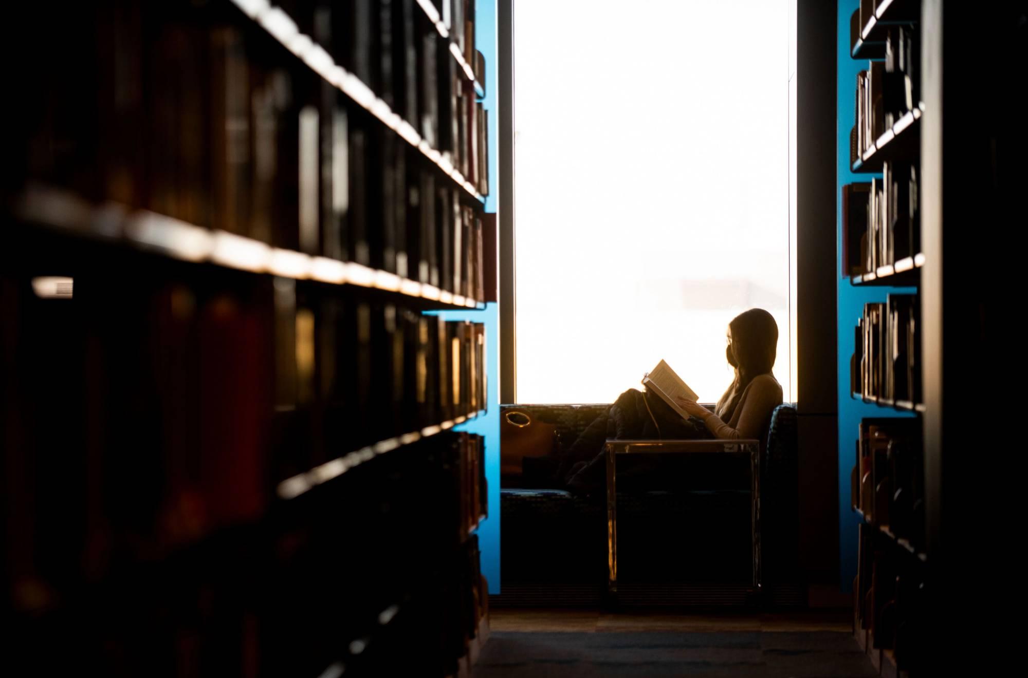 Picture of woman reading to child. Click to see juvenile justice major page